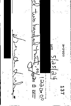 Check with personal information redacted showing signatures for comparison